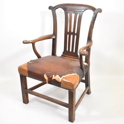 Lot 77 - A George III oak armchair with yoke-shaped top...