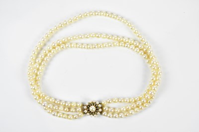 Lot 393 - A triple row cultured pearl necklace with 9ct...