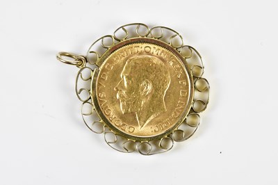 Lot 338 - A George V full sovereign, 1911, in 9ct yellow...