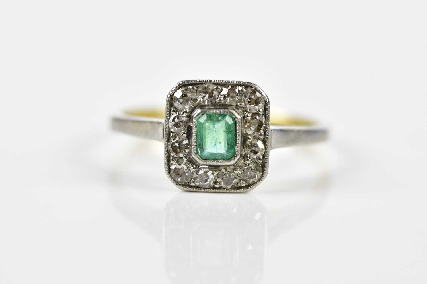 Lot 116 - An 18ct yellow gold emerald and diamond...