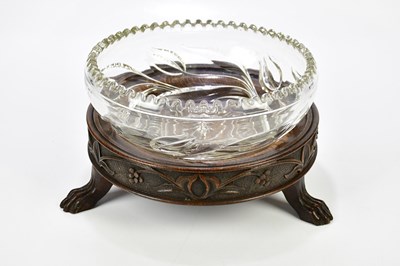 Lot 1313 - A 1920s carved oak circular stand with moulded...