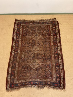 Lot 553 - A vintage woven Persian rug, 182cm x 123cm.
