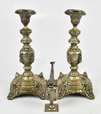 Lot 2082 - A pair of Continental white metal candlesticks...
