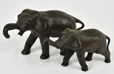 Lot 1451 - Two bronze models of elephants, length of...