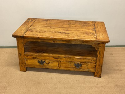 Lot 723 - A contemporary wooden coffee table with a...