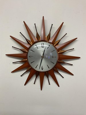 Lot 538 - METAMEC; a sunburst clock, diameter 18cm