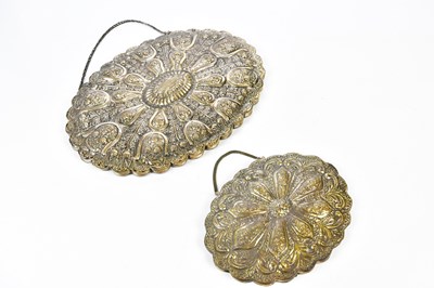 Lot 2206 - An Eastern white metal oval mirror with...