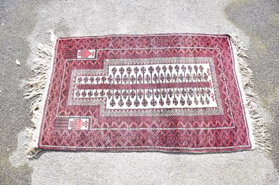 Lot 1207 - A Middle Eastern rug with central lozenge and...