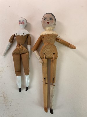 Lot 361 - A heavily restored wooden peg doll with...
