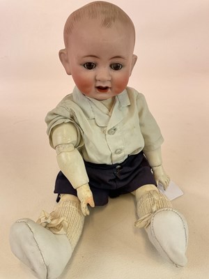 Lot 364 - A Deponiert 16" bisque head doll with moving...