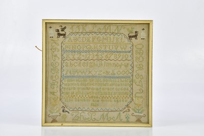 Lot 1401 - A 19th century alphabet sampler dated 1821, 29...