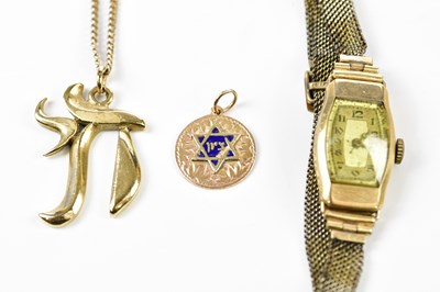 Lot 387 - A 9ct yellow gold chain suspending a 9ct gold...