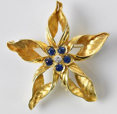 Lot 1447 - An 18ct yellow gold diamond and sapphire set...