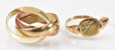 Lot 1456 - A group of three 9ct yellow gold interlocked...