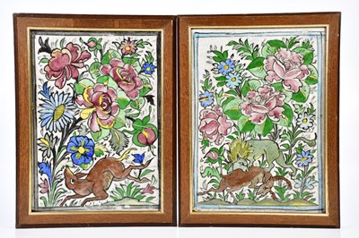 Lot 2591 - A pair of Iznik ceramic tiles decorated with a...