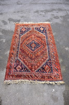 Lot 1202 - A large Eastern style rug with stylised...