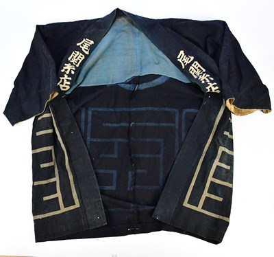 Lot 2680 - A Chinese robe decorated with stylised symbols.