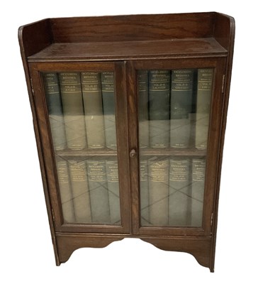 Lot 34 - A 1920s oak display cabinet with pair of...