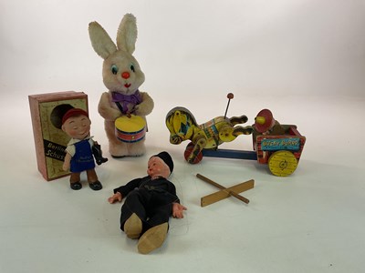 Lot 369 - A group of vintage toys including a battery...