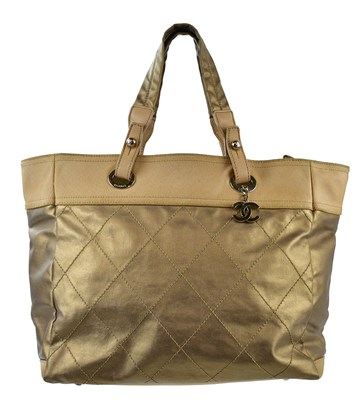 Lot 697 - CHANEL; a Paris-Biarritz coated quilted canvas...