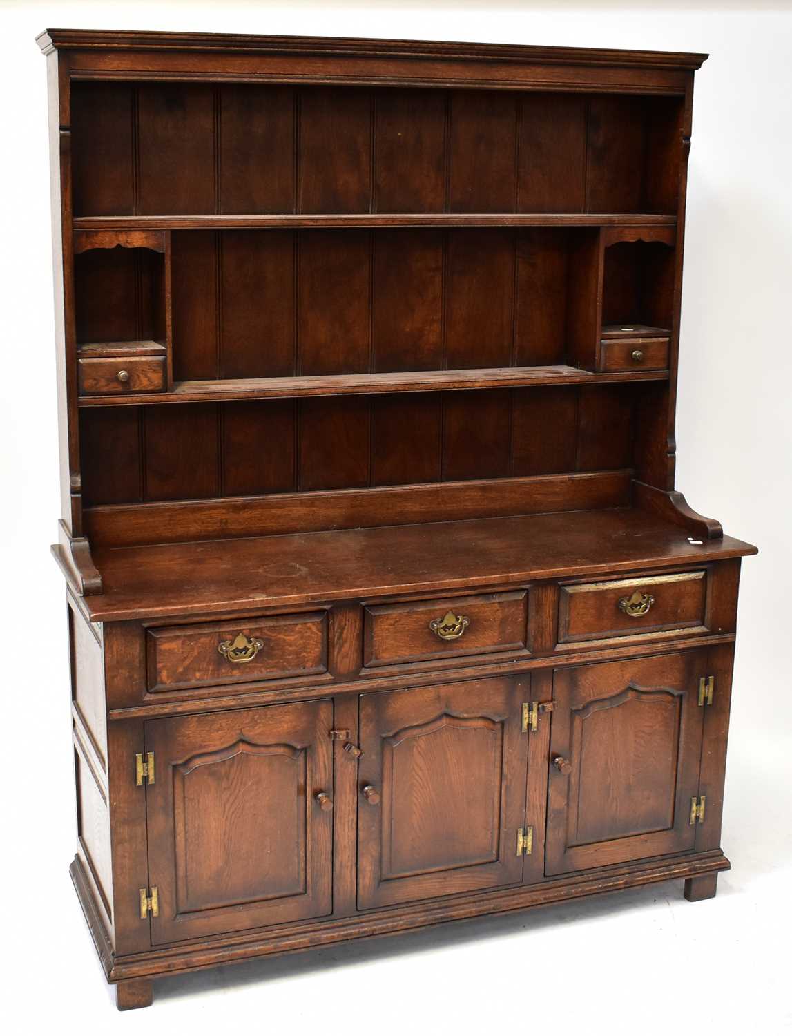 Lot 28 - A Georgian-style oak dresser with boarded...