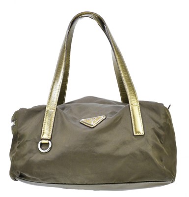 Lot 744 - PRADA; a brown nylon and antique gold leather...