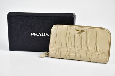Lot 838 - PRADA; an ecru cream nappa gauffre purse...