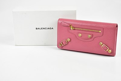 Lot 812 - BALENCIAGA; a pebbled pink leather long city...