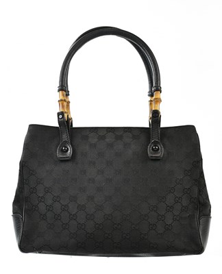 Lot 705 - GUCCI; a black GG medium monogram canvas...