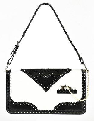 Lot 706 - CHRISTIAN DIOR; a black and white leather D...