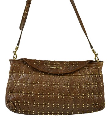 Lot 746 - MIU MIU; a quilted tan brown leather studded...