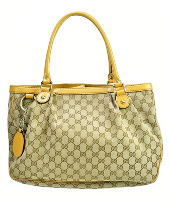 Lot 726 - GUCCI; a black MM canvas and beige leather...