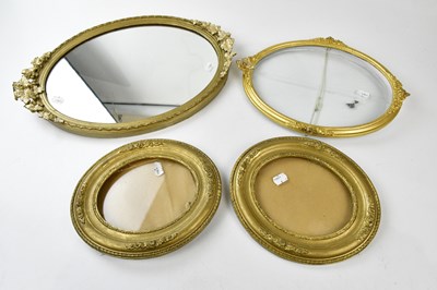 Lot 1055 - An early 20th century gilt framed oval wall...