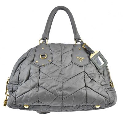 Lot 712 - PRADA; an Ardesia grey nylon quilted handbag...