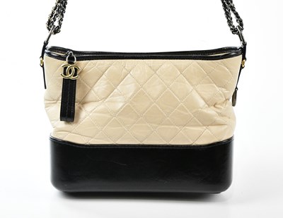 Lot 691 - CHANEL; a cream and black quilted calfskin...