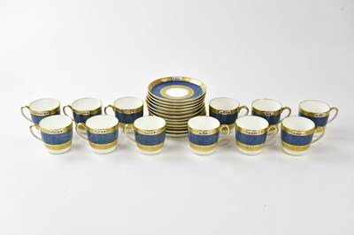 Lot 2857 - COALPORT; a pair of hand painted and gilt...