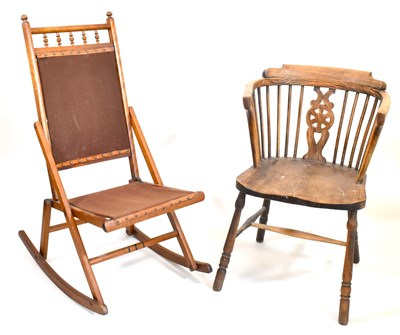 Lot 69 - A 19th century elm Windsor chair with stick...
