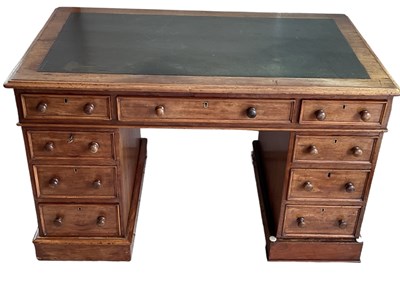 Lot 22 - A Victorian mahogany pedestal desk with black...