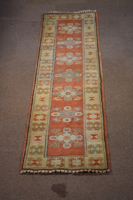 Lot 1214 - A hand woven wool runner, worked with a...