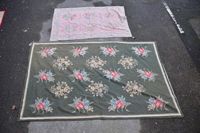 Lot 1204 - A tapestry carpet, worked with floral motifs...