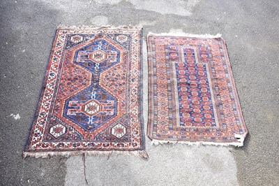 Lot 1205 - A Caucasian handwoven wool rug, decorated with...