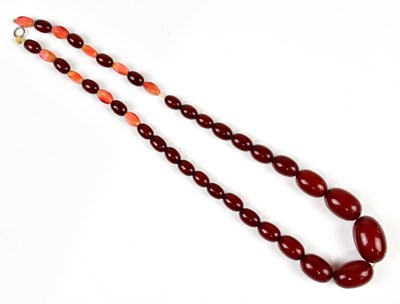 Lot 413 - A cherry amber and beaded necklace with nine...