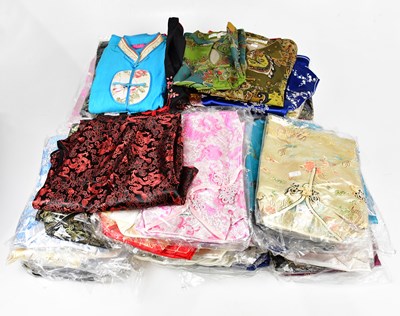 Lot 1397 - An extensive collection of Chinese silk dresses.
