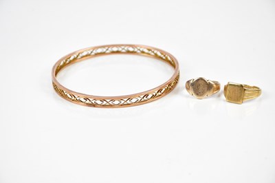 Lot 303 - A 9ct yellow gold bangle with openwork...