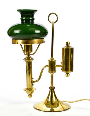 Lot 1569 - A 20th century brass reading lamp with green...