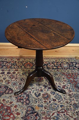 Lot 1195 - An 18th century oak tilt top tripod table,...