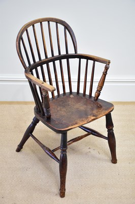 Lot 1185 - An 19th century elm seated hoop back Windsor...