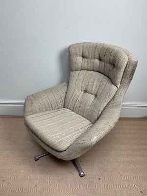 Lot 1160 - A retro mid century swivel chair upholstered...
