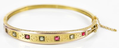 Lot 306 - A Victorian yellow metal snap bangle set with...