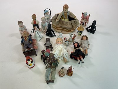 Lot 377 - A collection of various dolls and figures,...